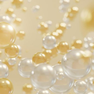 Zlaté a bílé bublinky znázorňující kolagen